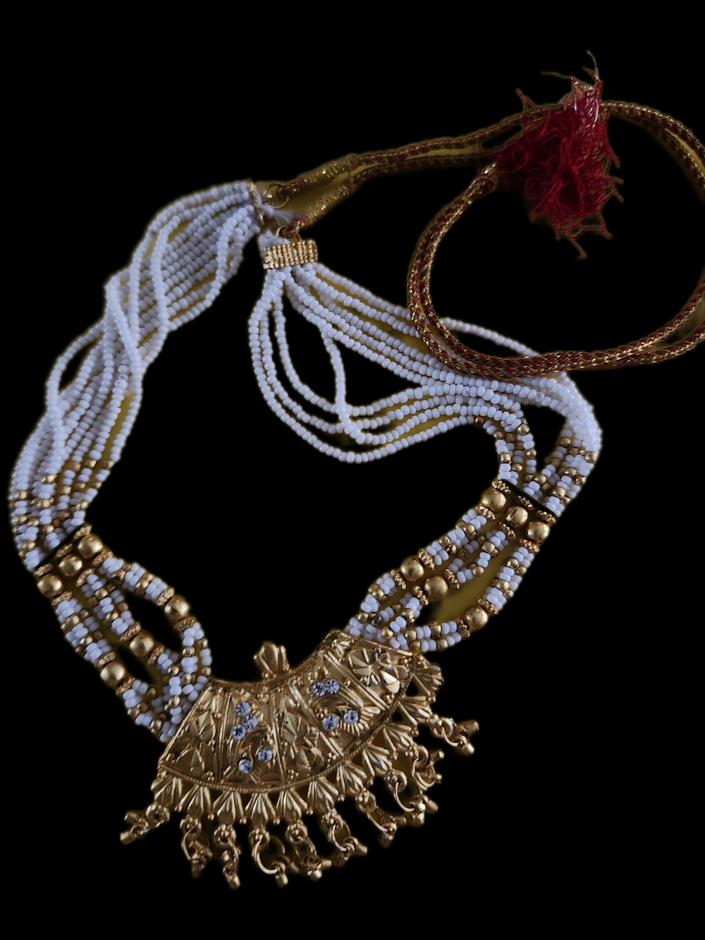White and Gold Beaded Multi-Strand Necklace with Ornate Gold Pendant